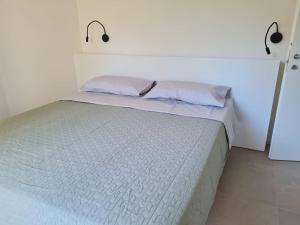 Una cama o camas en una habitación de Orto della Lepre