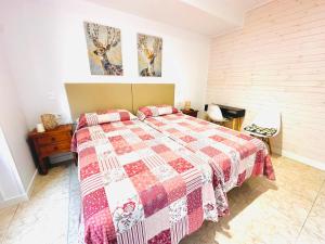 Postel nebo postele na pokoji v ubytování Hostal La Taberna
