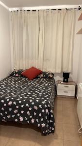 a bedroom with a black and white bed and a window at FH CAMP PRECIÓS I in Altea