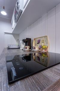 a kitchen with a counter top in a kitchen at Willa Grono in Krościenko +51 photos