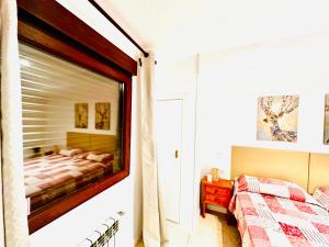 Postel nebo postele na pokoji v ubytování Hostal La Taberna