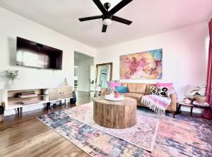 a living room with a couch and a table at Spotless Modern Home Close to LAX & Sofi Stadium in Inglewood