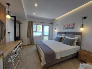 A bed or beds in a room at Sand and Sea