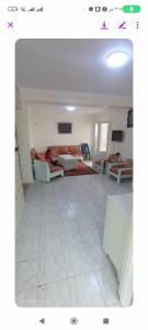 a living room with a couch and a table at فيلا دوبلكس على البحر مباشره in Arish