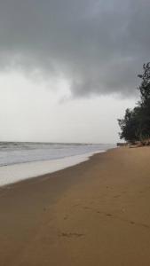 an empty beach with the ocean in the background at Rumah Seraya@Zaki’s Residence, Marang, Terengganu in Marang