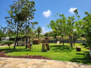 a park with a playground with a play equipment at Wai Wai Cumbuco Eco Residence - Bahamas 101 in Cumbuco