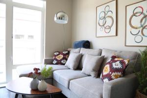 a living room with a couch and a table at Queen Anne Retreat - 1 Blk from CPA - Free Parking in Seattle