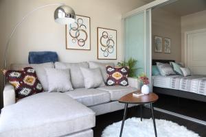 a living room with a couch and a bed at Queen Anne Retreat - 1 Blk from CPA - Free Parking in Seattle +26 photos