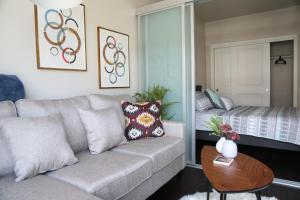 a living room with a couch and a bed at Queen Anne Retreat - 1 Blk from CPA - Free Parking in Seattle