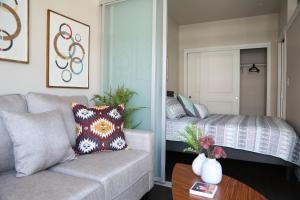 a living room with a couch and a bed at Queen Anne Retreat - 1 Blk from CPA - Free Parking in Seattle