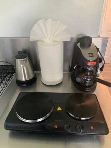 a stove top with a coffee maker and a blender at Walk to the beach, Studio, with Pool and FREE Parking in Hallandale Beach