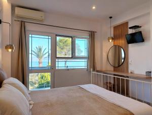 A bed or beds in a room at Sand and Sea
