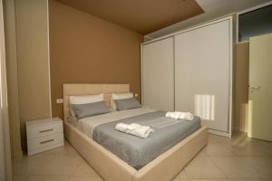 Postel nebo postele na pokoji v ubytování Appartamento Hakuna Matata