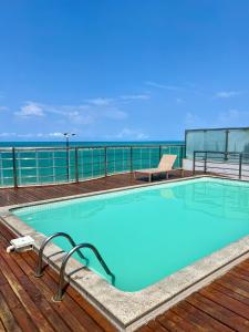a swimming pool on the deck of a cruise ship at APART HOTEL MANAÍRA PALACE in João Pessoa
