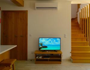 A television and/or entertainment centre at SWEET HOME MILFONTES by Stay in Alentejo