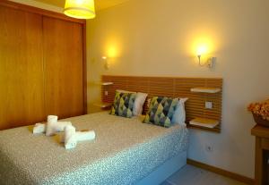 A bed or beds in a room at SWEET HOME MILFONTES by Stay in Alentejo