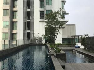 The swimming pool at or close to St Moritz Apartment Puri Indah