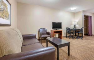 a living room with a couch and a tv at Studio 6 Extended Stay Florence KY - Meijer Dr Cincinnati in Florence