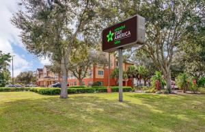 a sign in a park in front of a building at Extended Stay America Select Suites - Tampa - North - USF - Attractions in Tampa