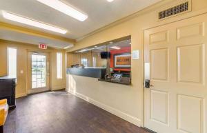 an office lobby with a door and a counter at Extended Stay America Suites - Fort Lauderdale - Tamarac in Fort Lauderdale