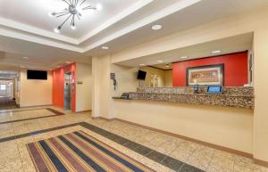 a lobby of a hotel with a reception counter at Extended Stay America Suites - Chesapeake - Greenbrier Circle in Chesapeake