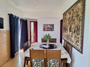 a dining room with a table and chairs at Pousada JP in Vila Nova do Sul +29 photos