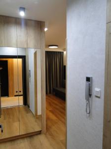 a phone hanging on a wall in a room at Stare Miasto Elbląg Bulvar in Elblag +25 photos