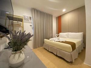 Postel nebo postele na pokoji v ubytování ILOILO GRAND HOTEL
