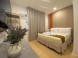 Postel nebo postele na pokoji v ubytování ILOILO GRAND HOTEL
