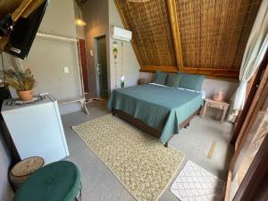 Pousada Villa di Luna客房内的一张或多张床位