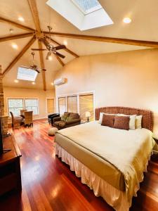 a bedroom with a large bed in a room at The Inn at Shasta Lake in Lakehead