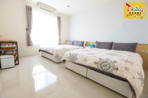 Letto o letti in una camera di 充電樁 羅東雲朵朵Cloud B&B免費洗衣機 烘衣機 近週三清溝 星巴克咖啡豆 國旅卡特約店