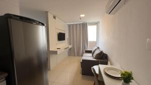 Et tv og/eller underholdning på Aconchegante apartamento no DF Plaza