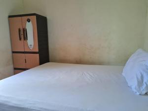Ένα ή περισσότερα κρεβάτια σε δωμάτιο στο ONara Homestay