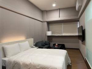 Postel nebo postele na pokoji v ubytování 藝築文旅-昆明館Artinn Kunming