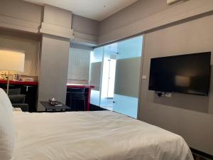 Postel nebo postele na pokoji v ubytování 藝築文旅-昆明館Artinn Kunming