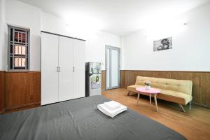 Postel nebo postele na pokoji v ubytování Cali Homestay
