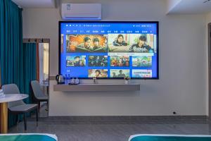 TV a/nebo společenská místnost v ubytování Zhuhai Golden Lake Bay Hotel + 17 fotografií