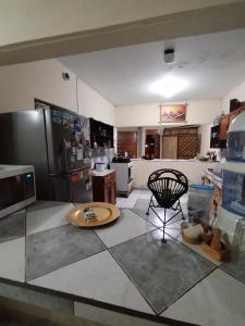 an aerial view of a kitchen with a table at Casa BBb Punta Hermosa Planicie in Punta Hermosa