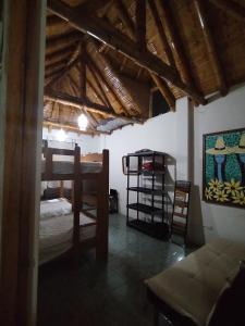 a room with a bunk bed and a table in it at Casa BBb Punta Hermosa Planicie in Punta Hermosa