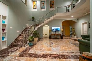 eine Treppe in einem Haus mit Steinboden in der Unterkunft MERAKI VILLA - 5 BR Luxury Villa with private pool in Udaipur