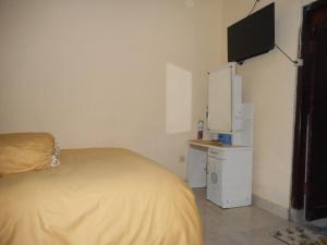 Η κουζίνα ή μικρή κουζίνα στο Jro Pesimpangan Homestay