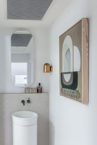 a bathroom with a toilet and a mirror at AL Sole - 4 Bedrooms - Pool - Location in Sunshine Beach