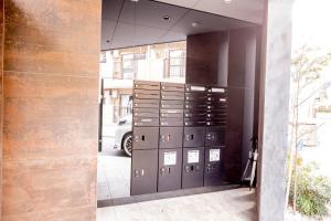 a bunch of lockers in a building with at The most comfortable and best choice for accommodation in Yoyogi SioY5 in Tokyo