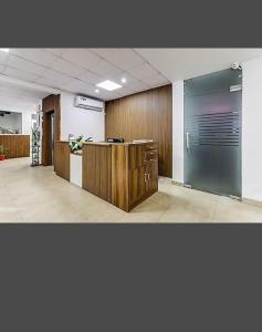 an office with a large glass door in a room at YWCA International Guest House in New Delhi