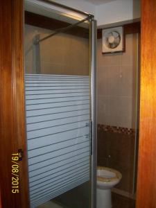 a bathroom with a shower and a toilet at Jomtien Condotel Condominium in Pattaya South