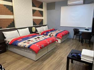 Postel nebo postele na pokoji v ubytování Star Moon Forest Inn