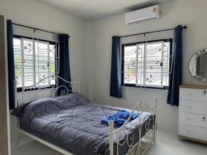 Postel nebo postele na pokoji v ubytování Tai Chon Pool Villa ใต้ชล พูลวิลล่า