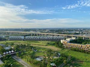 an aerial view of a campus with buildings and trees at Apt Vasanta Innopark Studio S1oN with Pool in Jarakasta
