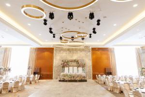 a banquet hall with a table and chairs in a room at Hotel Сomplex Irtysh in Pavlodar